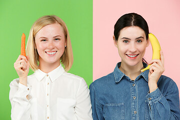 Image showing Beautiful close-up portrait of young women with fruits and vegetables. Healthy food concept.