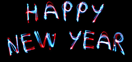 Image showing NEW YEAR CELEBRATTION concept. 2019 HAPPY NEW YEAR text fluorescent Neon tube Sign on dark brick wall.