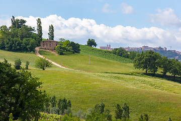 Image showing Camerino in Italy Marche over colourful fields