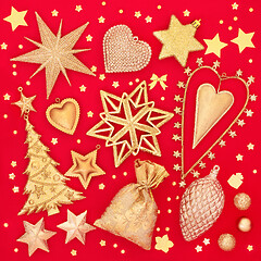 Image showing Gold Christmas Tree Decorations On Red Background