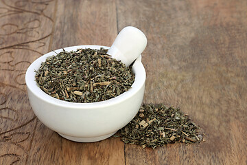 Image showing Pulsatilla Herb in a Mortar with Pestle