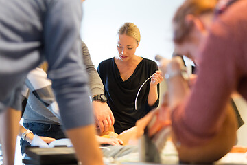 Image showing Medical doctor specialist expert displaying method of patient intubation on hands on medical education training and workshop. Participants learning new medical procedures and techniques.