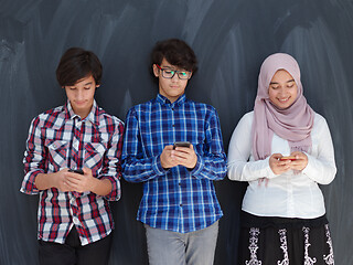 Image showing arab teenagers group using smart phones for social media network