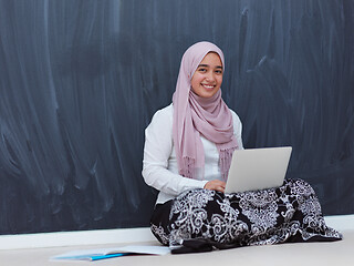 Image showing arab female student working on laptop