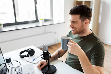 Image showing blogger with laptop and microphone audio blogging