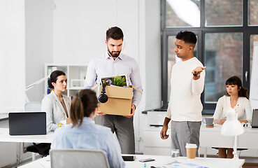 Image showing fired sad male office worker leaving