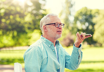 Image showing old man using voice command recorder on smartphone