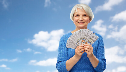 Image showing senior woman with hundred dollar money banknotes