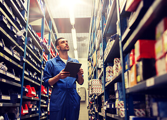 Image showing auto mechanic or smith with tablet pc at workshop