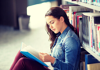 Image showing high school student girl reading book at library