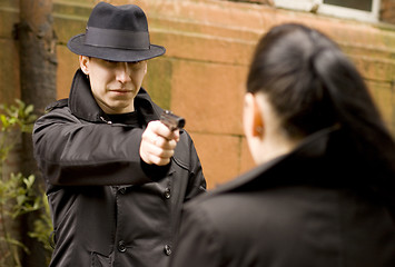 Image showing man threatens the woman with gun