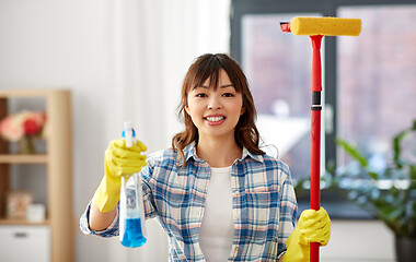 Image showing asian woman with window detergent and sponge mop