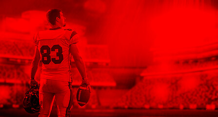 Image showing duo toned american football player in  arena at night