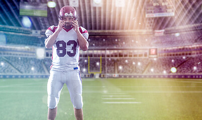 Image showing American Football Player isolated on big modern stadium field