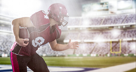 Image showing American football Player running with the ball