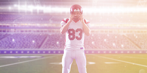 Image showing American Football Player isolated on big modern stadium field