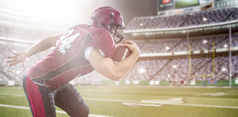 Image showing American football Player running with the ball