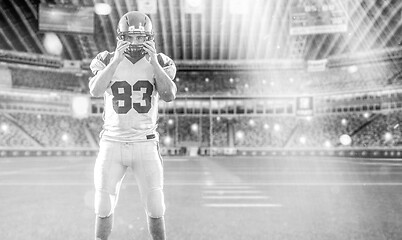 Image showing American Football Player isolated on big modern stadium field