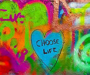 Image showing Detail of bright colorful John Lennon's wall with graffiti in Pr