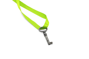 Image showing Vintage silver key with green ribbon