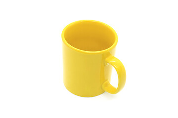 Image showing Bright yellow ceramic cup with handle