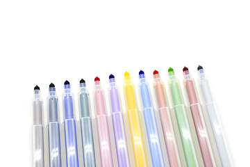 Image showing Open multicolored markers on a white background