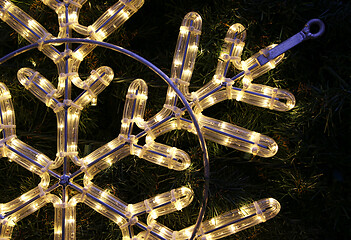 Image showing Close-up of bright glowing led christmas snowflake