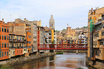 Image showing Colorful houses and Eiffel bridge on river Onyar in Girona