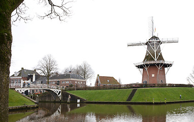 Image showing Dokkum, the Netherlands on December 26, 2019: Canal and windmill