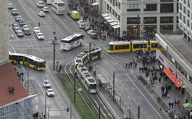 Image showing BERLIN, GERMANY on December 31, 2019: People pass tram ways in t