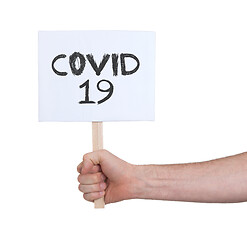 Image showing Sign in a hand, isolated on white