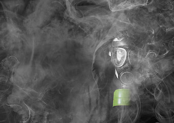 Image showing Man in a gas mask in the smoke