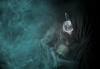 Image showing Man in a gas mask in the toxic smoke