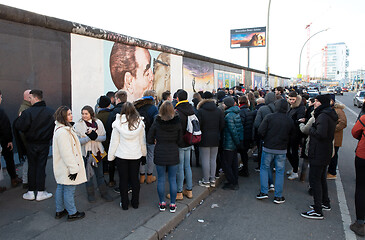 Image showing Berlin, Germany on Januari 1, 2020: Tourists in front of a kissi