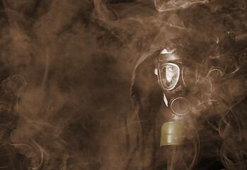 Image showing Man in a gas mask in the toxic smoke