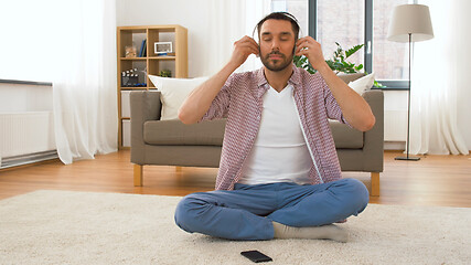 Image showing man in headphones chilling at home