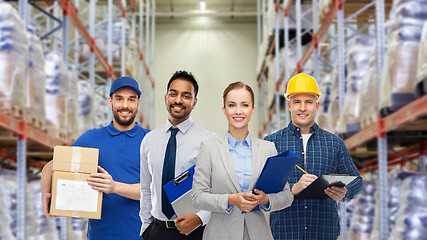 Image showing group of business people and warehouse workers