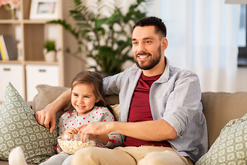 Image showing happy father and daughter watching tv at home