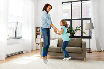 Image showing mother and daughter having fun at home