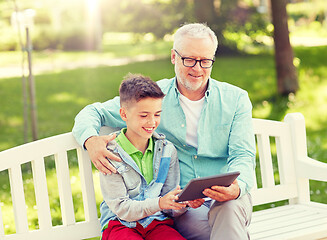 Image showing grandfather and boy with tablet pc at summer park