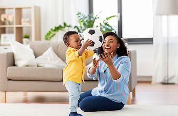 Image showing mother and baby playing with soccer ball at home