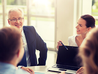 Image showing business people with laptop meeting in office