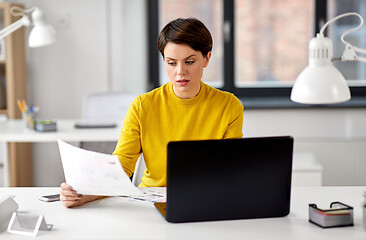 Image showing creative woman working on user interface at office