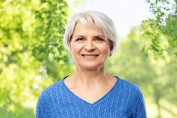 Image showing portrait of smiling senior woman in blue sweater