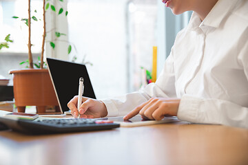 Image showing Caucasian entrepreneur, businesswoman, manager working concentrated in office, close up, focus on hands