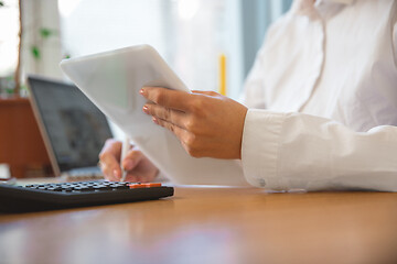 Image showing Caucasian entrepreneur, businesswoman, manager working concentrated in office, close up, focus on hands