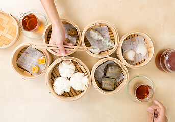 Image showing Top view of eating with dim sum