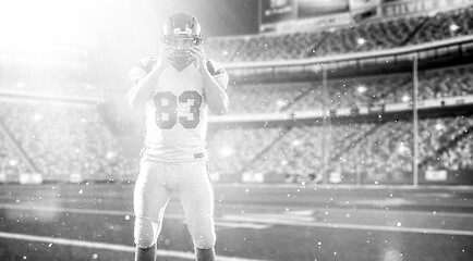 Image showing American Football Player isolated on big modern stadium field