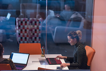 Image showing businesswoman using a laptop in startup office