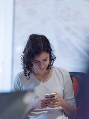 Image showing Businesswoman typing on phone  in office